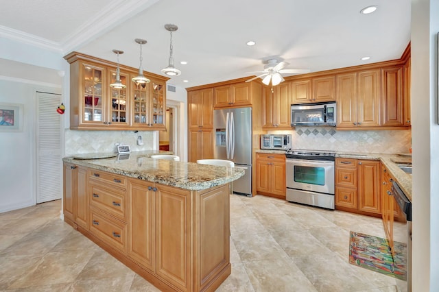 kitchen with tasteful backsplash, decorative light fixtures, stainless steel appliances, and ceiling fan