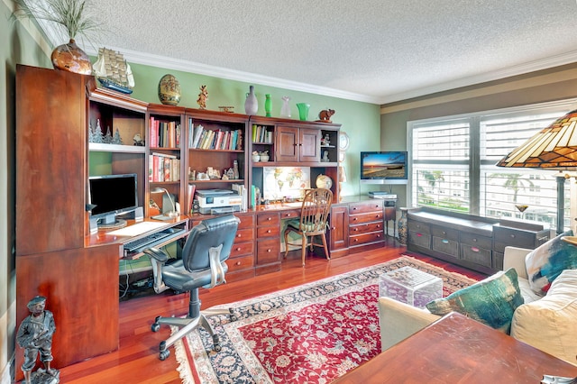 office area featuring hardwood / wood-style floors, a textured ceiling, and crown molding