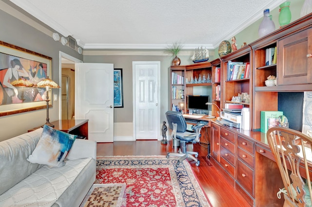 office area with wood-type flooring, a textured ceiling, and ornamental molding