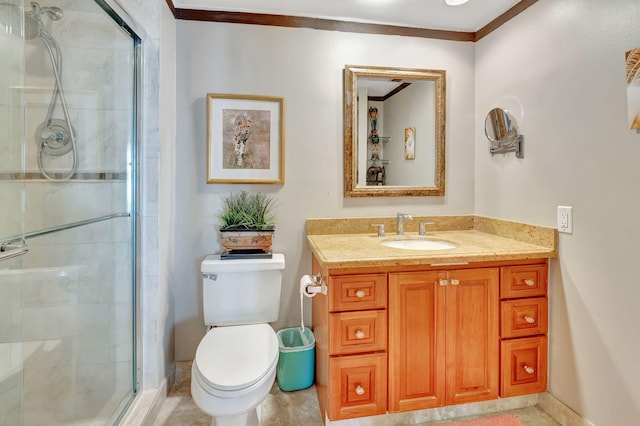 bathroom with crown molding, vanity, an enclosed shower, and toilet