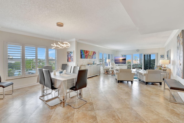 dining space featuring light tile patterned flooring, a chandelier, a textured ceiling, and ornamental molding