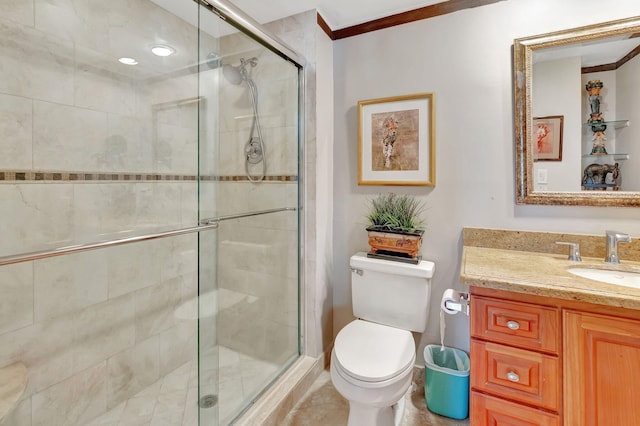 bathroom with walk in shower, toilet, vanity, and ornamental molding