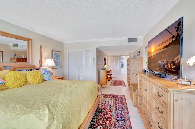 tiled bedroom featuring crown molding, a textured ceiling, and a closet