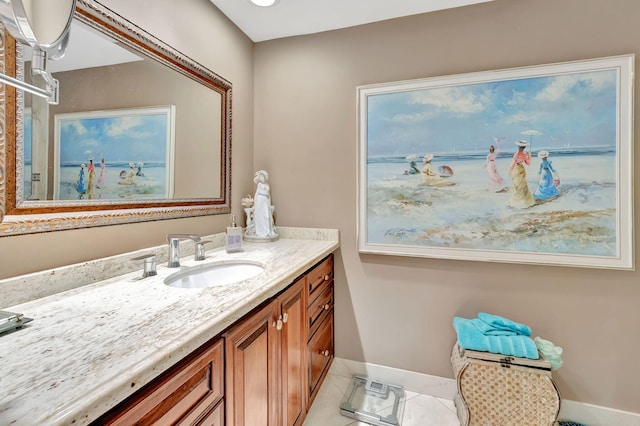 bathroom featuring tile patterned flooring and vanity