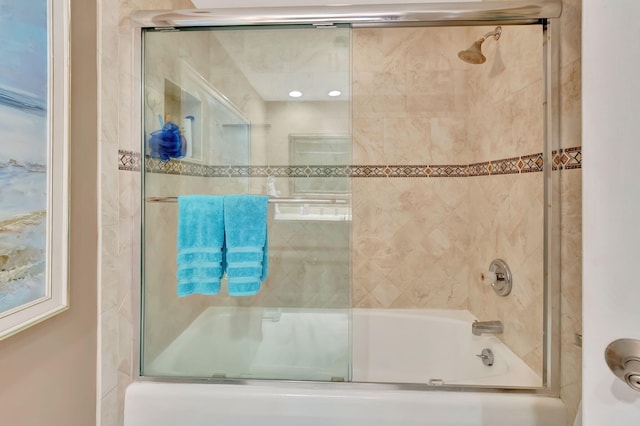 bathroom featuring shower / bath combination with glass door