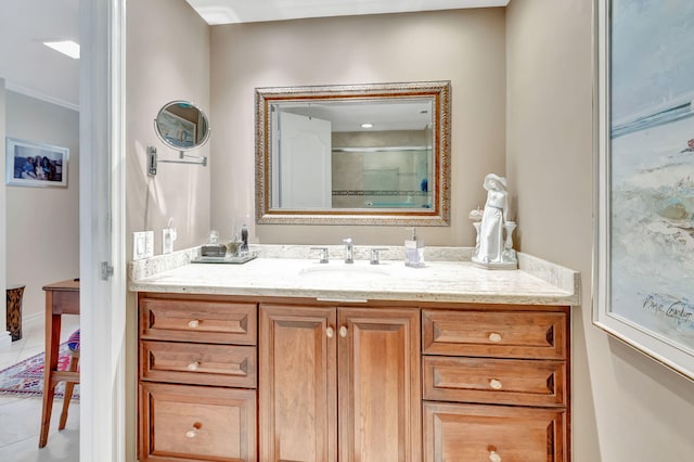 bathroom featuring crown molding, tile patterned flooring, vanity, and a shower with shower door