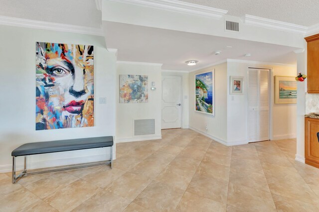 interior space with crown molding and light tile patterned flooring