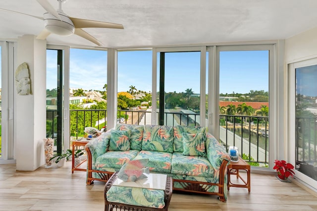 sunroom / solarium with ceiling fan