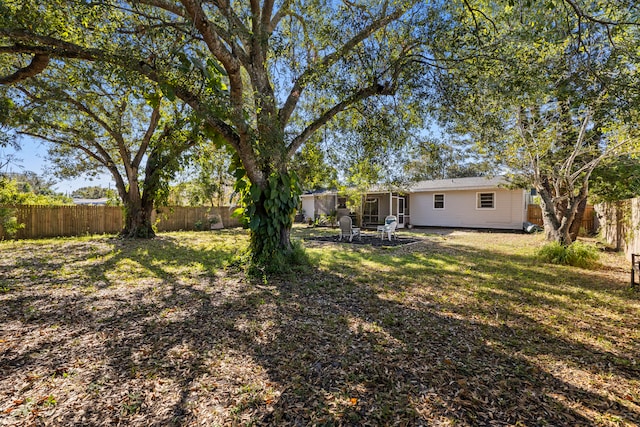 view of yard with a patio and a fenced backyard