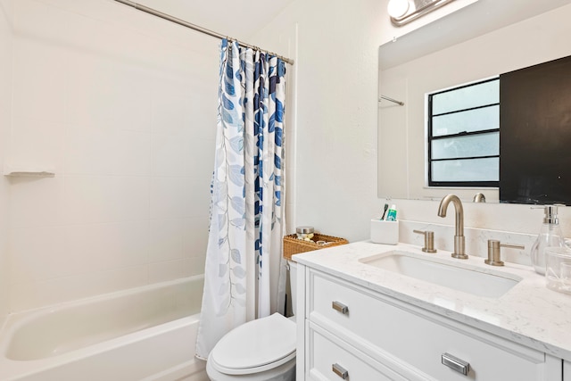 full bath with vanity, toilet, and shower / tub combo with curtain