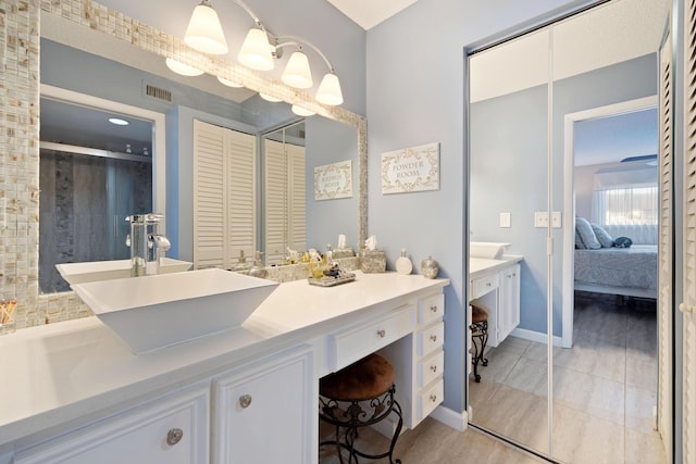 bathroom featuring tile patterned flooring and vanity