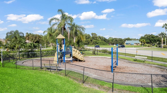 view of jungle gym with a lawn