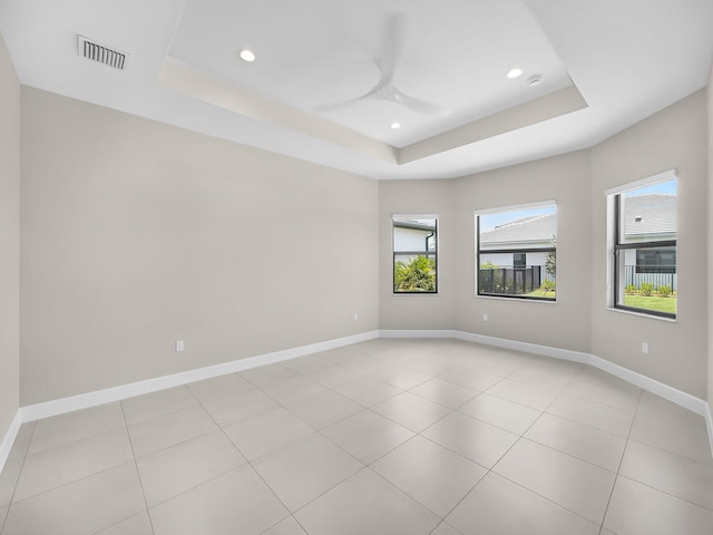 11282 SW Sea Cove Ln, Port Saint Lucie, FL 34987 - unfurnished room with a raised ceiling, recessed lighting, a ceiling fan, baseboards, and light tile patterned floors