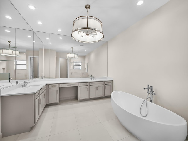 11282 SW Sea Cove Ln, Port Saint Lucie, FL 34987 - full bathroom featuring double vanity, a soaking tub, plenty of natural light, recessed lighting, and a chandelier