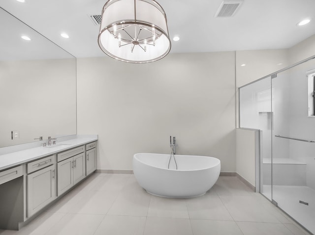 11282 SW Sea Cove Ln, Port Saint Lucie, FL 34987 - bathroom featuring vanity, baseboards, a freestanding bath, a shower stall, and recessed lighting