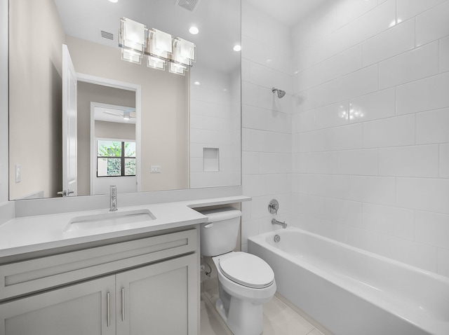 11282 SW Sea Cove Ln, Port Saint Lucie, FL 34987 - bathroom with toilet, vanity, washtub / shower combination, and tile patterned floors