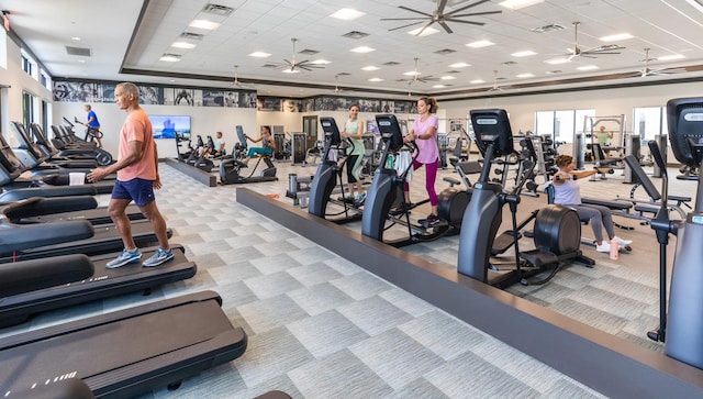 11282 SW Sea Cove Ln, Port Saint Lucie, FL 34987 - exercise room featuring carpet flooring, ceiling fan, a drop ceiling, and a tray ceiling