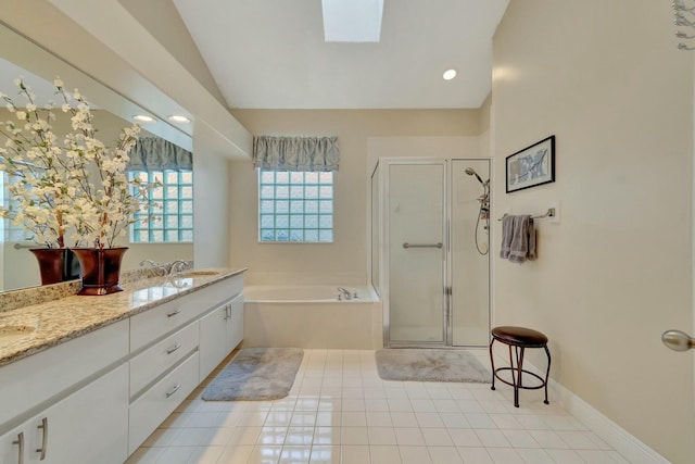 bathroom featuring tile patterned flooring, vanity, lofted ceiling with skylight, and shower with separate bathtub