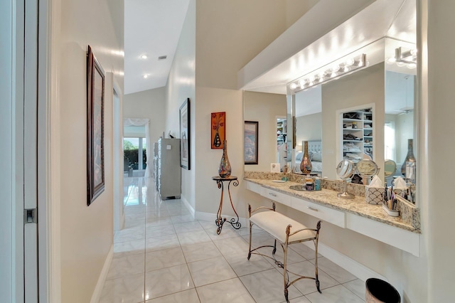 bathroom with tile patterned flooring, ceiling fan, and vanity