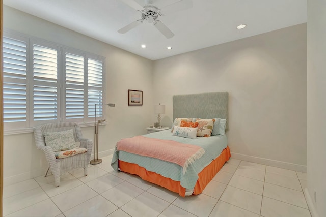 bedroom with ceiling fan and light tile patterned flooring