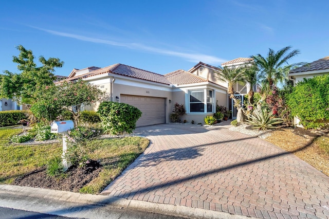 mediterranean / spanish house featuring a garage