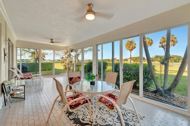 sunroom with ceiling fan and plenty of natural light