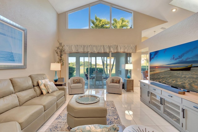 living room featuring light tile patterned flooring and high vaulted ceiling