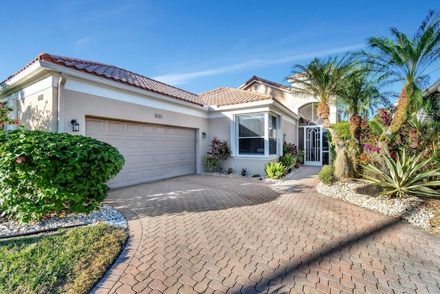 mediterranean / spanish house featuring a garage