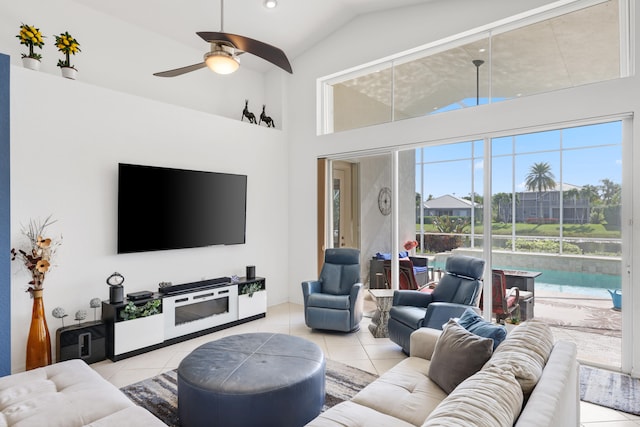 living room with light tile patterned floors and ceiling fan