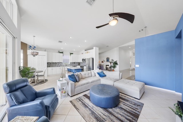 tiled living room with vaulted ceiling and ceiling fan