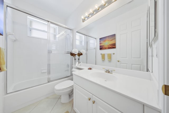 full bathroom with toilet, tile patterned flooring, enclosed tub / shower combo, and vanity