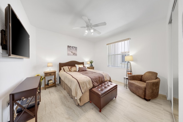 bedroom featuring ceiling fan and a closet