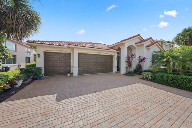 mediterranean / spanish-style house featuring a garage