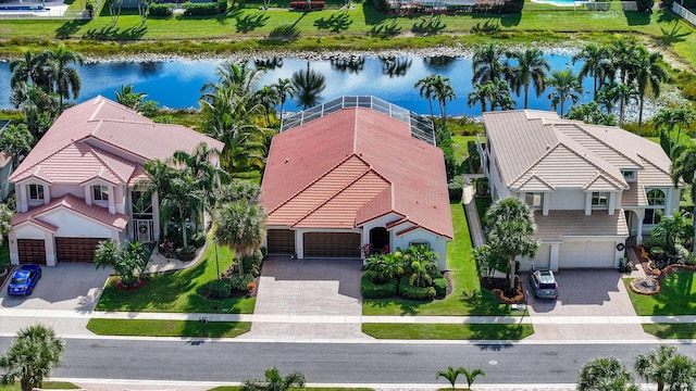 birds eye view of property featuring a water view