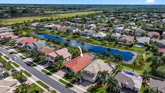 drone / aerial view with a water view