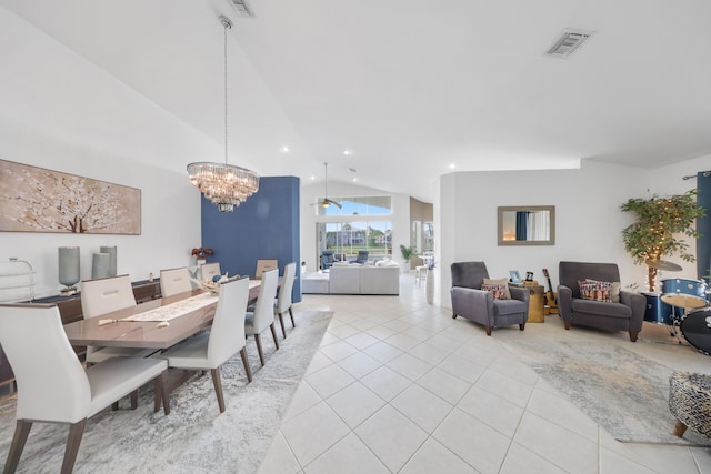 dining space featuring light tile patterned floors, lofted ceiling, and a chandelier