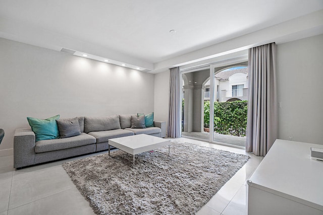 living room with light tile patterned flooring