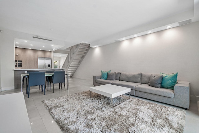 living room featuring light tile patterned floors