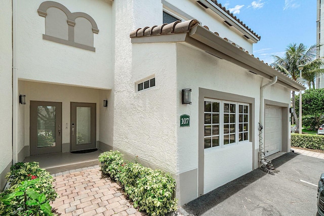 entrance to property featuring a garage