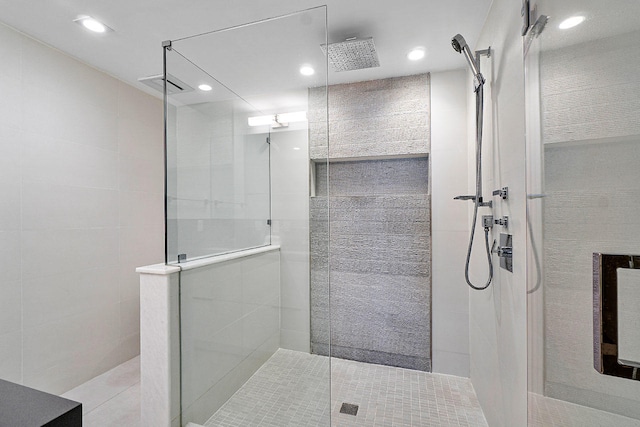 bathroom with tiled shower