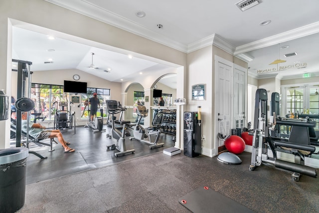 gym featuring vaulted ceiling and ornamental molding