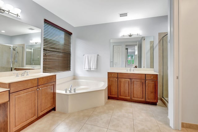 bathroom featuring separate shower and tub, tile patterned flooring, vanity, and a healthy amount of sunlight