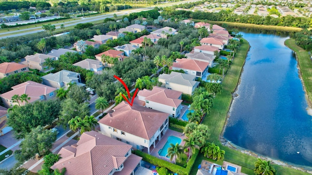 birds eye view of property with a water view