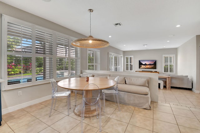 dining space with light tile patterned flooring