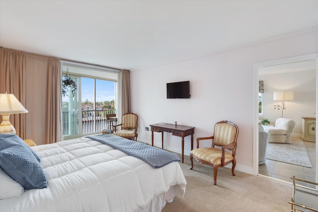 bedroom featuring light carpet