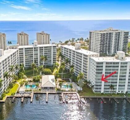 birds eye view of property with a water view