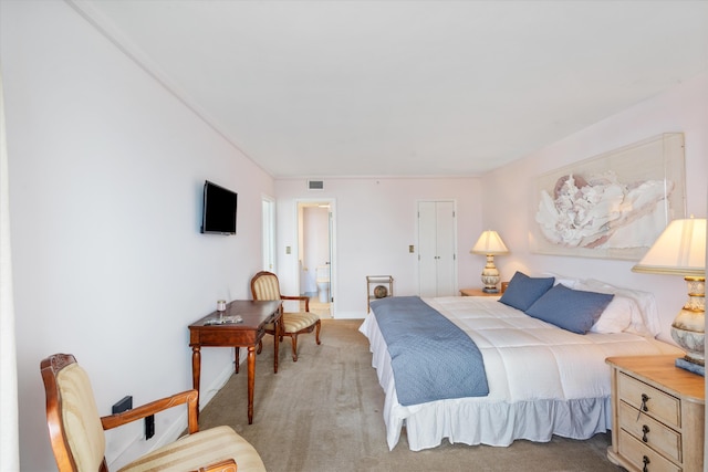 bedroom with light colored carpet