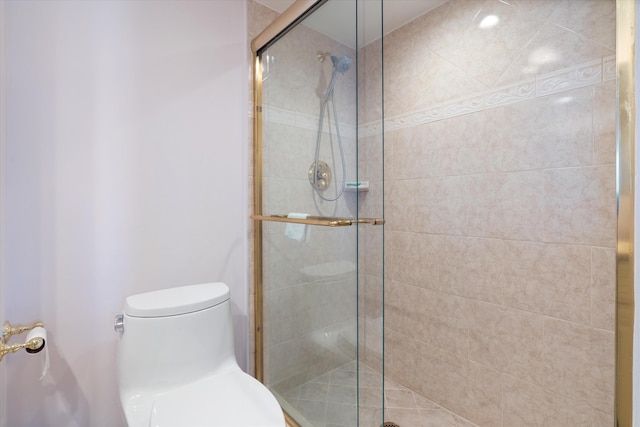 bathroom featuring toilet and walk in shower