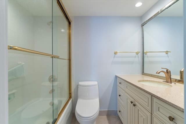 full bathroom featuring shower / bath combination with glass door, tile patterned flooring, vanity, and toilet