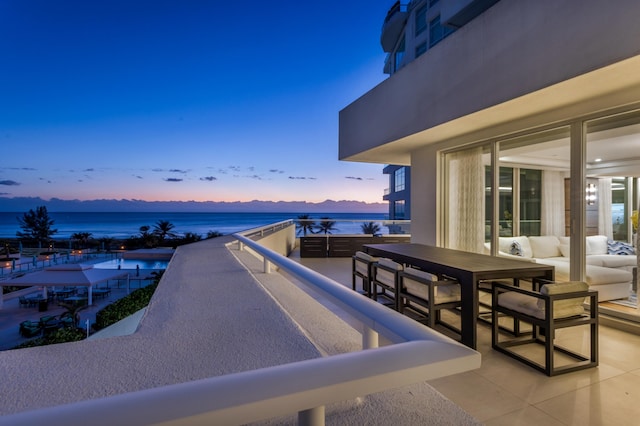 balcony at dusk with a water view